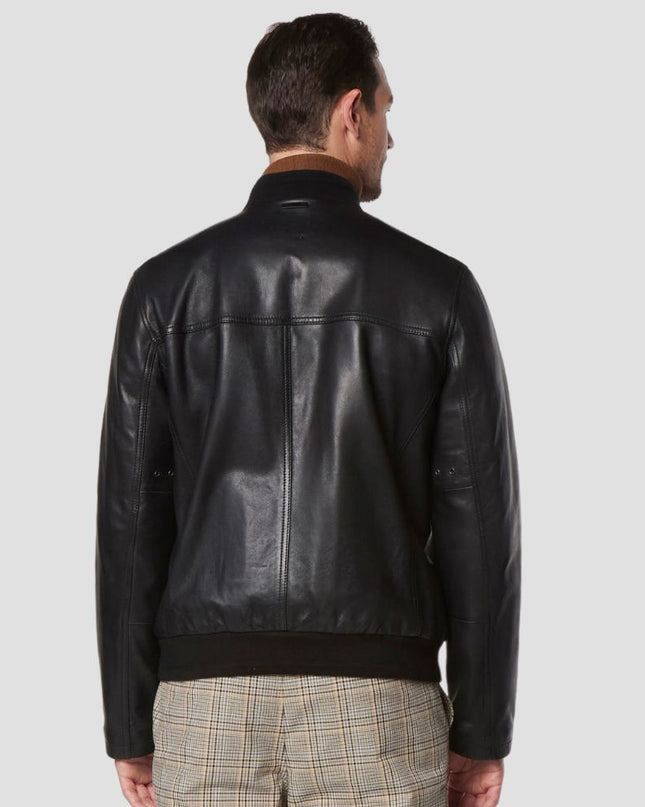 Man wearing a black leather jacket on a light gray background