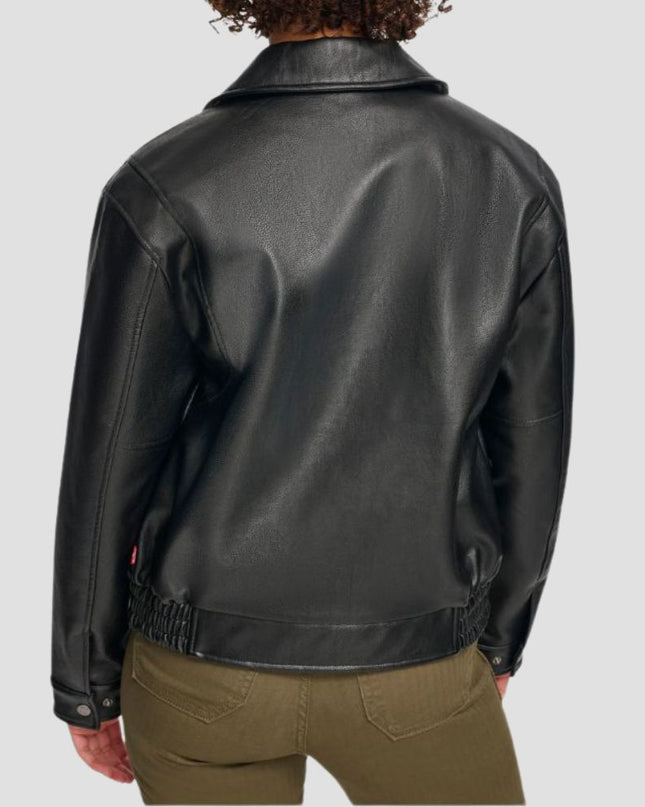Black leather jacket worn by a person on a light gray background