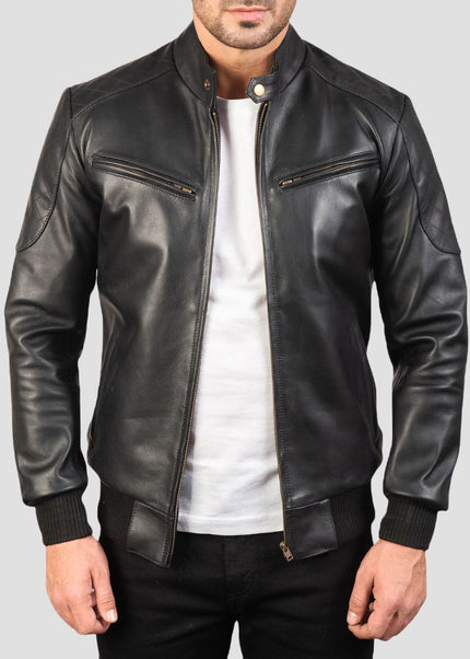 Black leather jacket worn by a person on a gray background