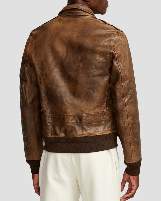 Brown leather jacket worn by a person on a light gray background