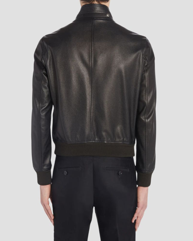 Black leather jacket worn by a person on a light gray background