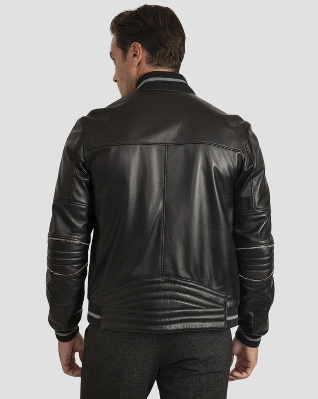 Man wearing a black leather jacket on a light gray background