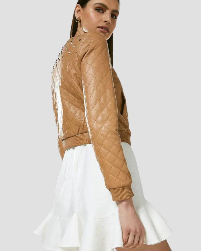 Woman wearing a brown quilted jacket on a white background