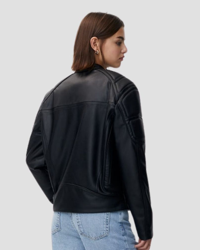 Person wearing a black leather jacket on a light gray background