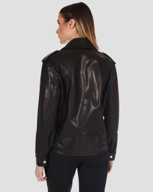 Person wearing a black leather jacket on a plain background