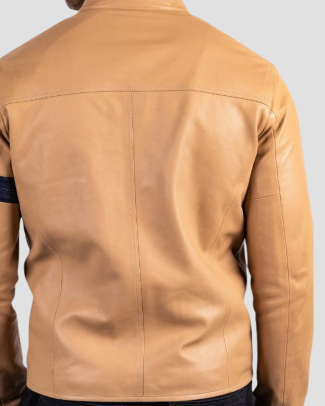 Tan leather jacket with dark blue arm strip on a light gray background
