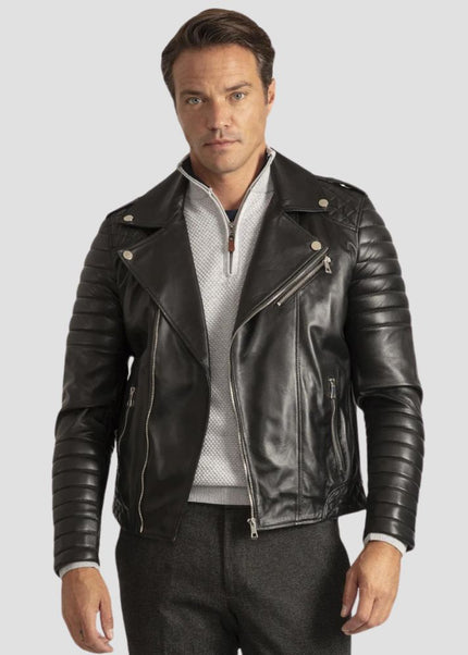 Man wearing a black leather jacket on a light gray background