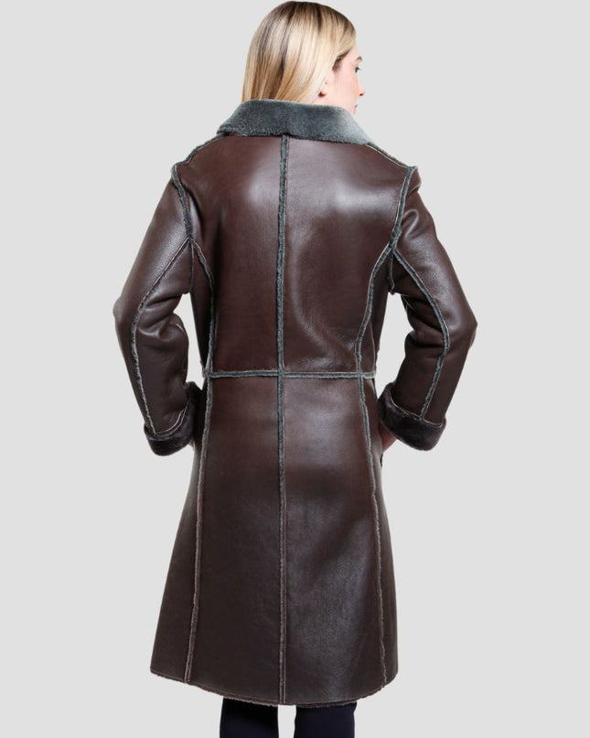 Brown leather coat worn by a person on a light gray background