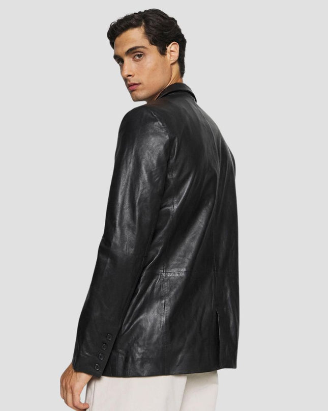 Man wearing a black leather jacket on a light gray background