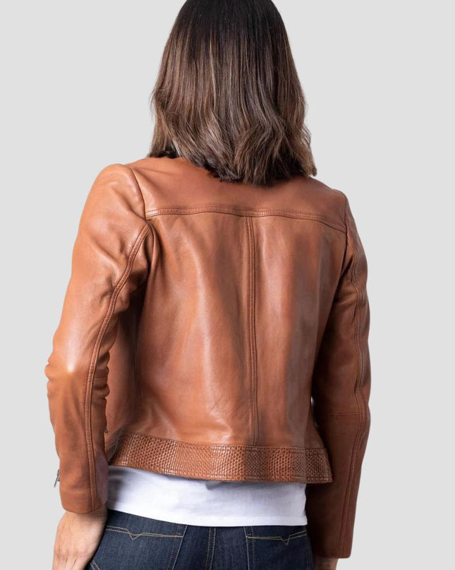 Brown leather jacket worn by a person on a light gray background