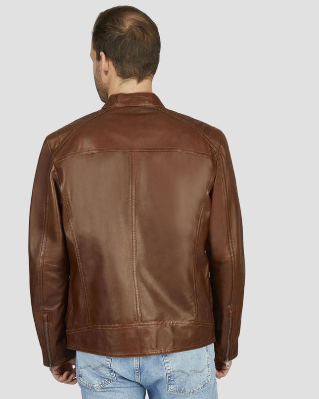 Man wearing a brown leather jacket on a plain background