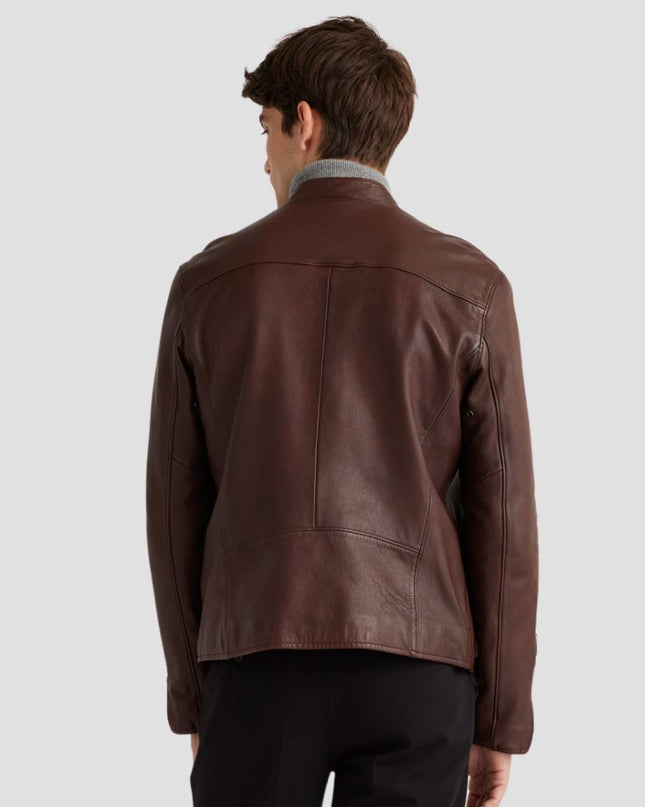Man wearing a brown leather jacket on a light gray background