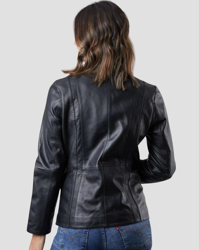 Person wearing a black leather jacket on a plain background