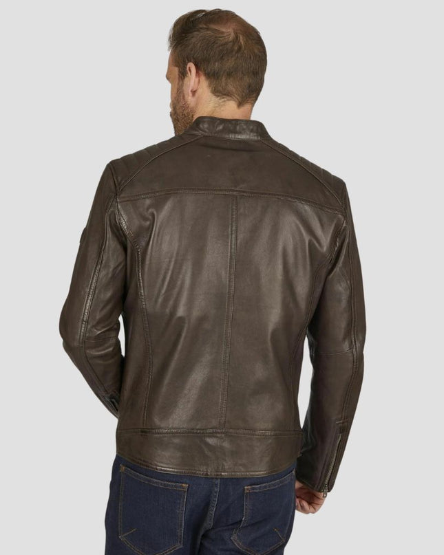 Man wearing a brown leather jacket on a plain background