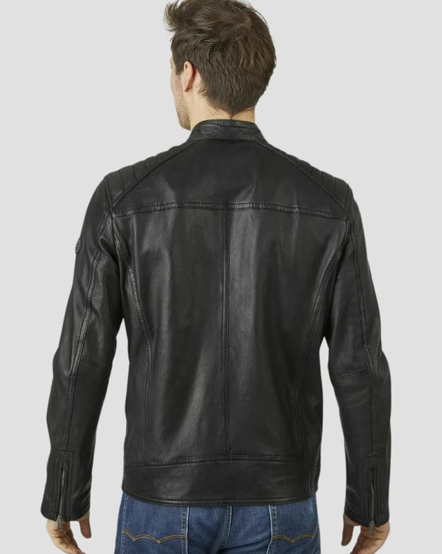 Man wearing a black leather jacket on a light gray background