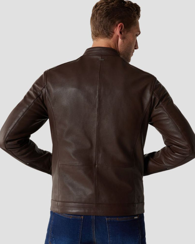 Man wearing a brown leather jacket on a light gray background