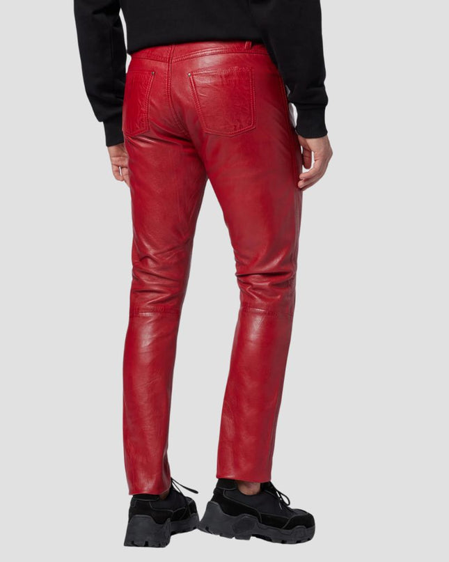 Red leather pants worn by a person on a light gray background