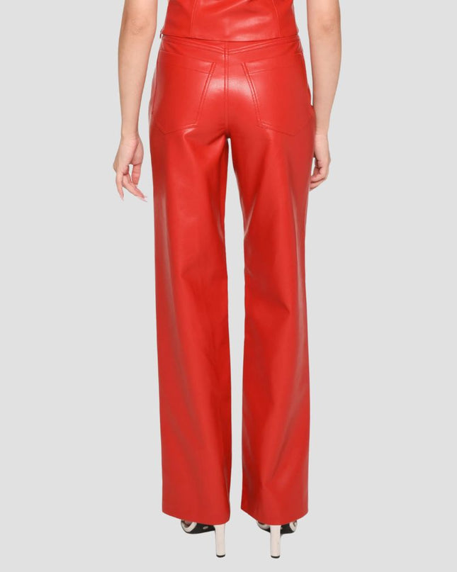 Red leather pants worn by a person on a gray background