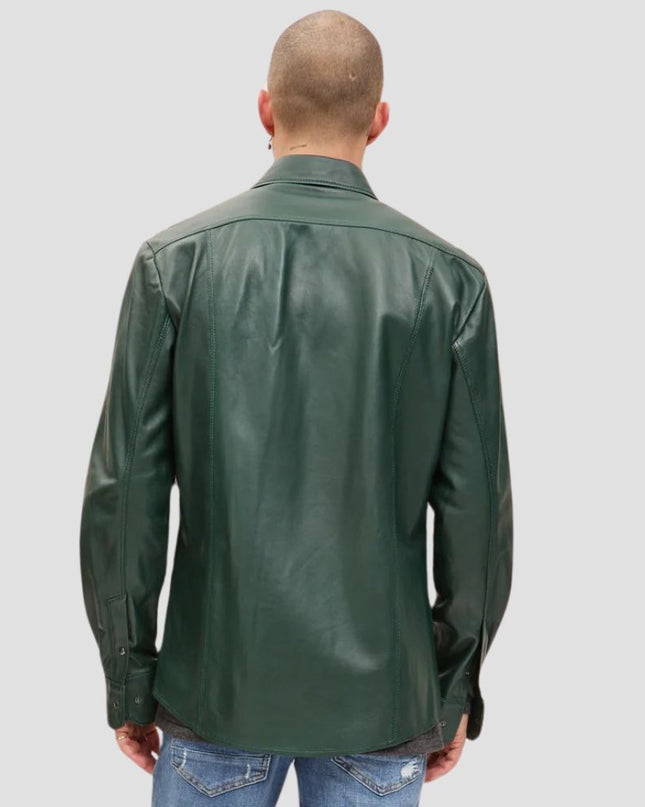 Man wearing a green leather jacket on a plain background
