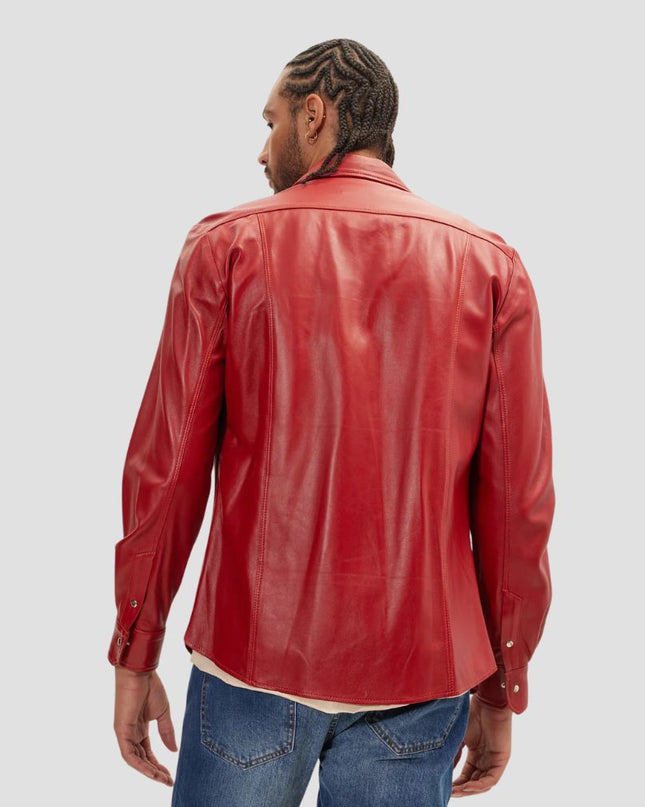 Person wearing a red leather jacket on a plain background