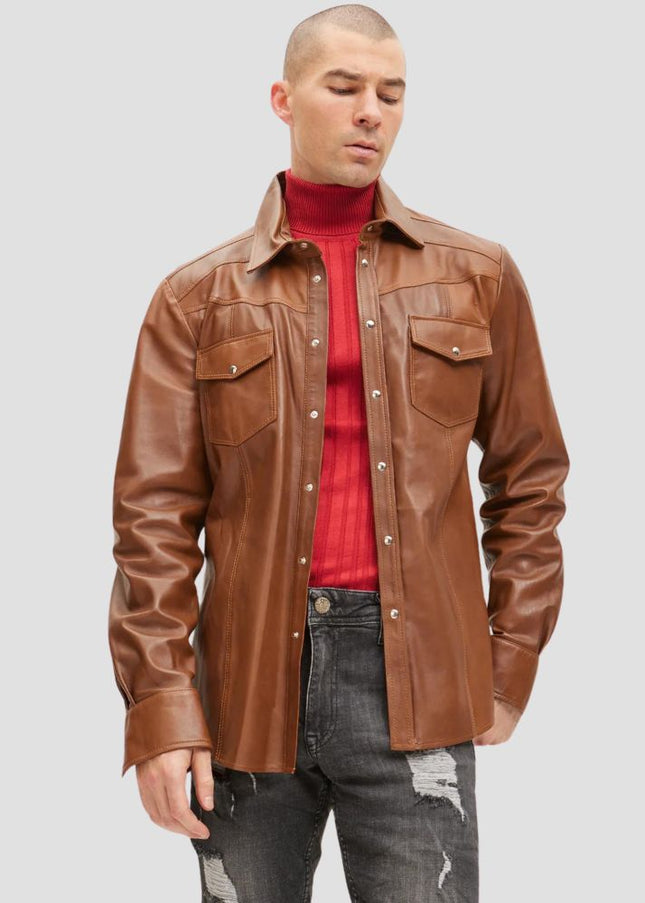 Man wearing a brown leather jacket over a red shirt on a gray background