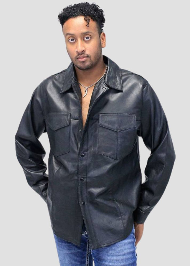 Man wearing a black leather shirt against a gray background