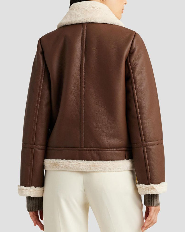 Brown leather jacket with white fur lining on a plain background
