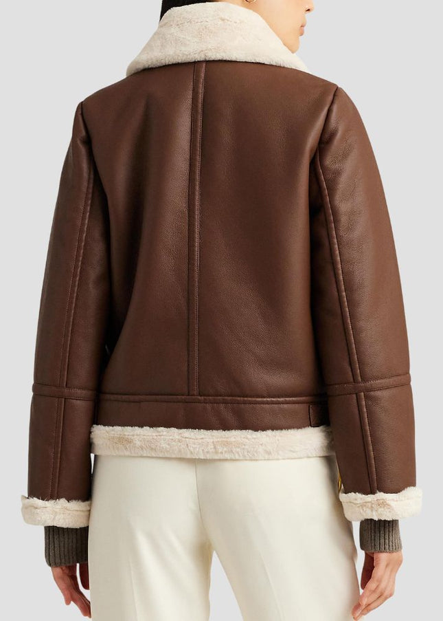 Brown leather jacket with white fur lining on a plain background