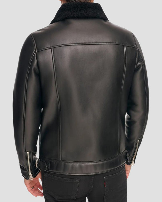 Black leather jacket worn by a person on a light gray background