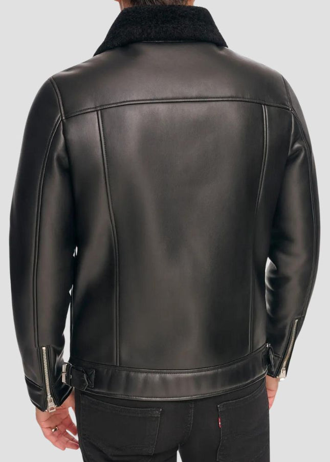 Black leather jacket worn by a person on a light gray background
