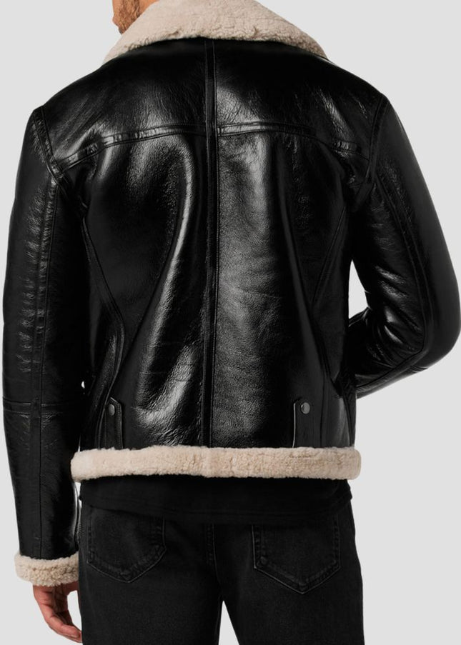 Black leather jacket with beige shearling collar and cuffs on a plain background