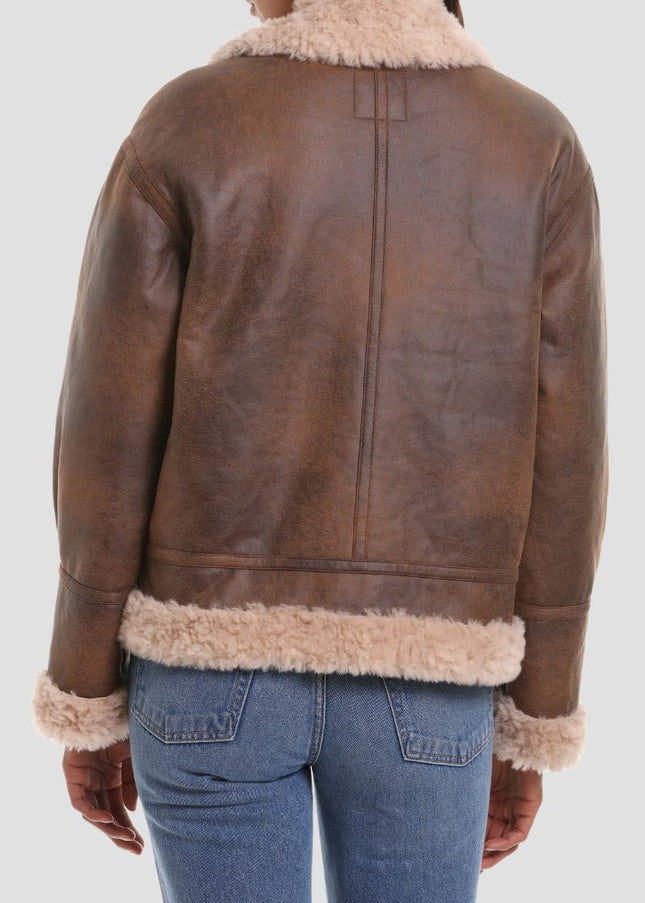 Brown leather jacket with fur trim on a white background