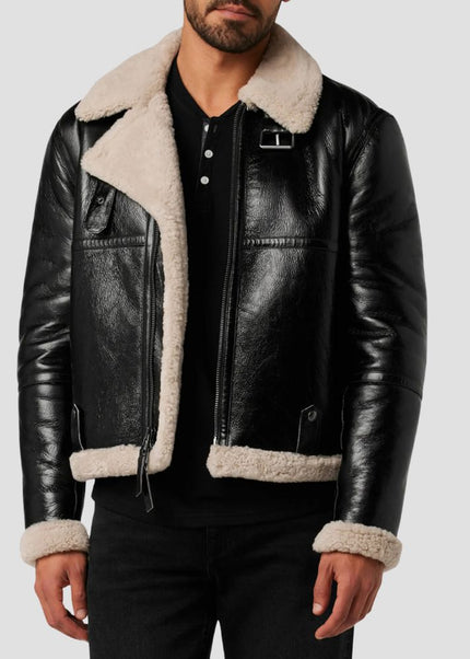 Black leather jacket with white fur lining worn by a person on a light gray background