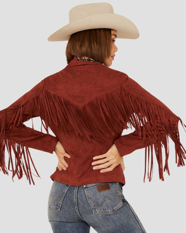 Person wearing a red fringed jacket and beige cowboy hat on a light gray background