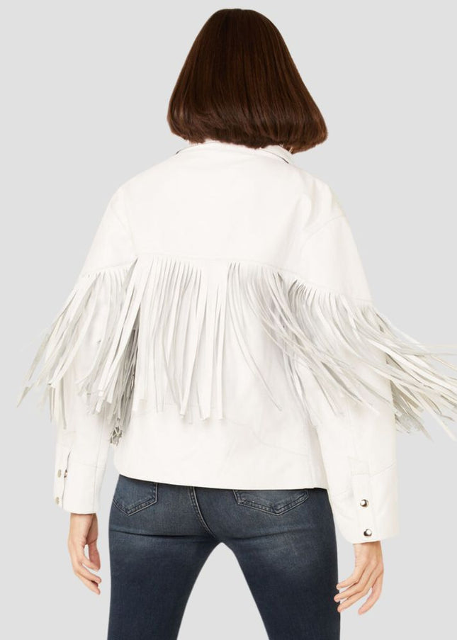 Person wearing a white fringed jacket on a plain background