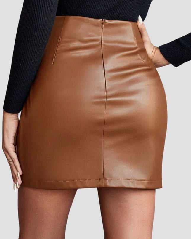 Brown leather skirt worn by a person on a plain background