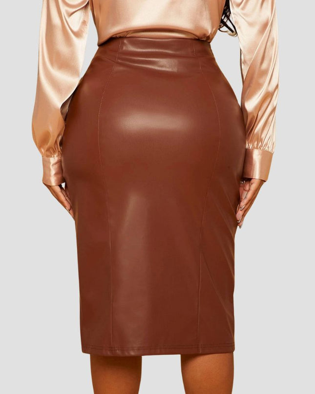 Brown leather skirt worn by a person on a light gray background